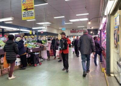 Man with accordion inside market