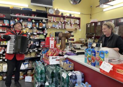 Man playing accordion to woman