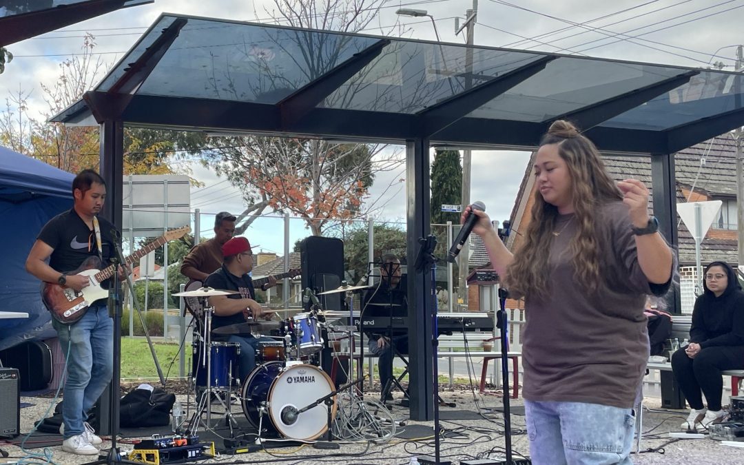Woman singing with band