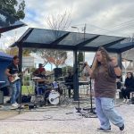 Woman singing with band