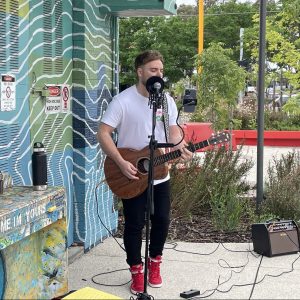 Man busing and playing guitar